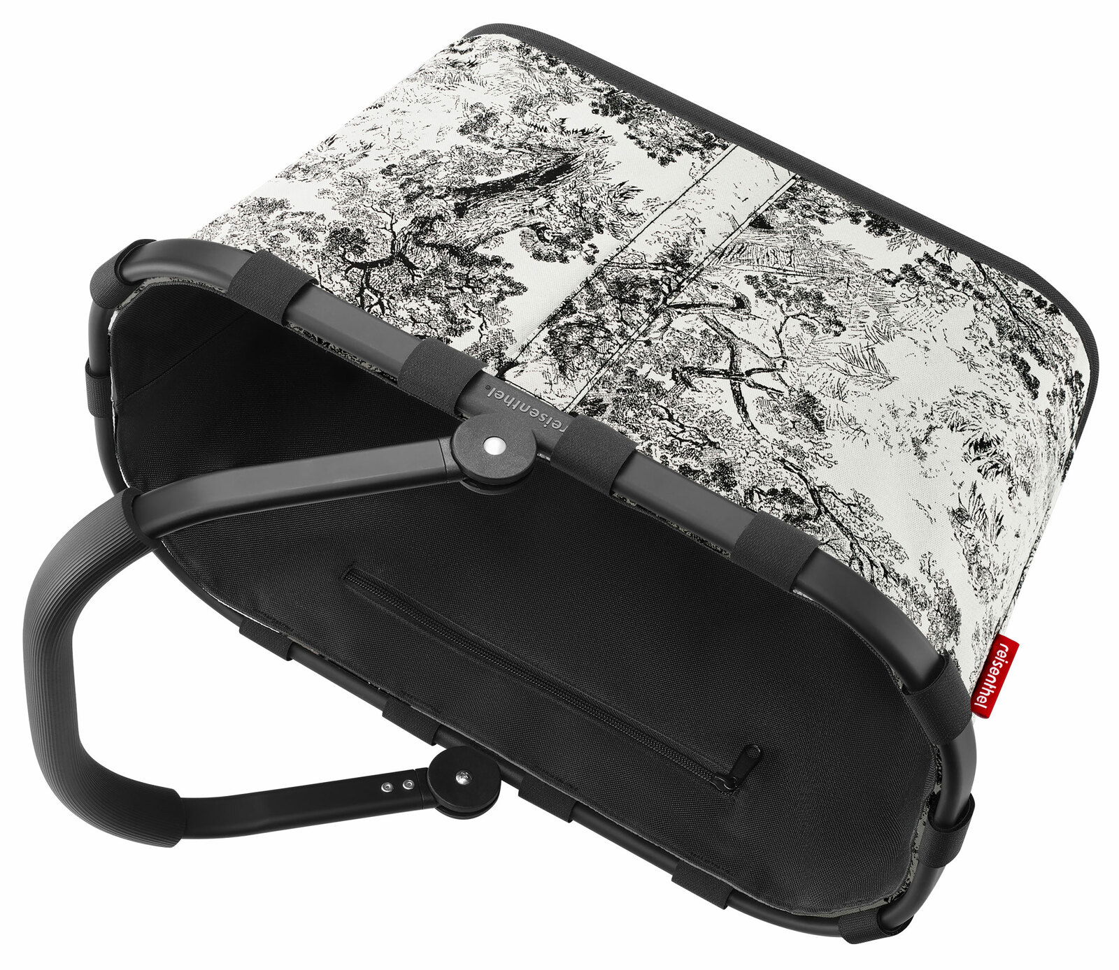 Carrybag mit schwarzem Rahmen und Griff, dekoriert mit einem schwarz-weißen Landschaftsmuster, aus der Perspektive von oben seitlich betrachtet.