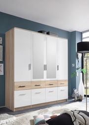 Moderner 4-türiger Drehtürenschrank mit Spiegeln und Schubladen, aus Holz und weißem Material, in einem stilvollen Raum von vorne betrachtet.