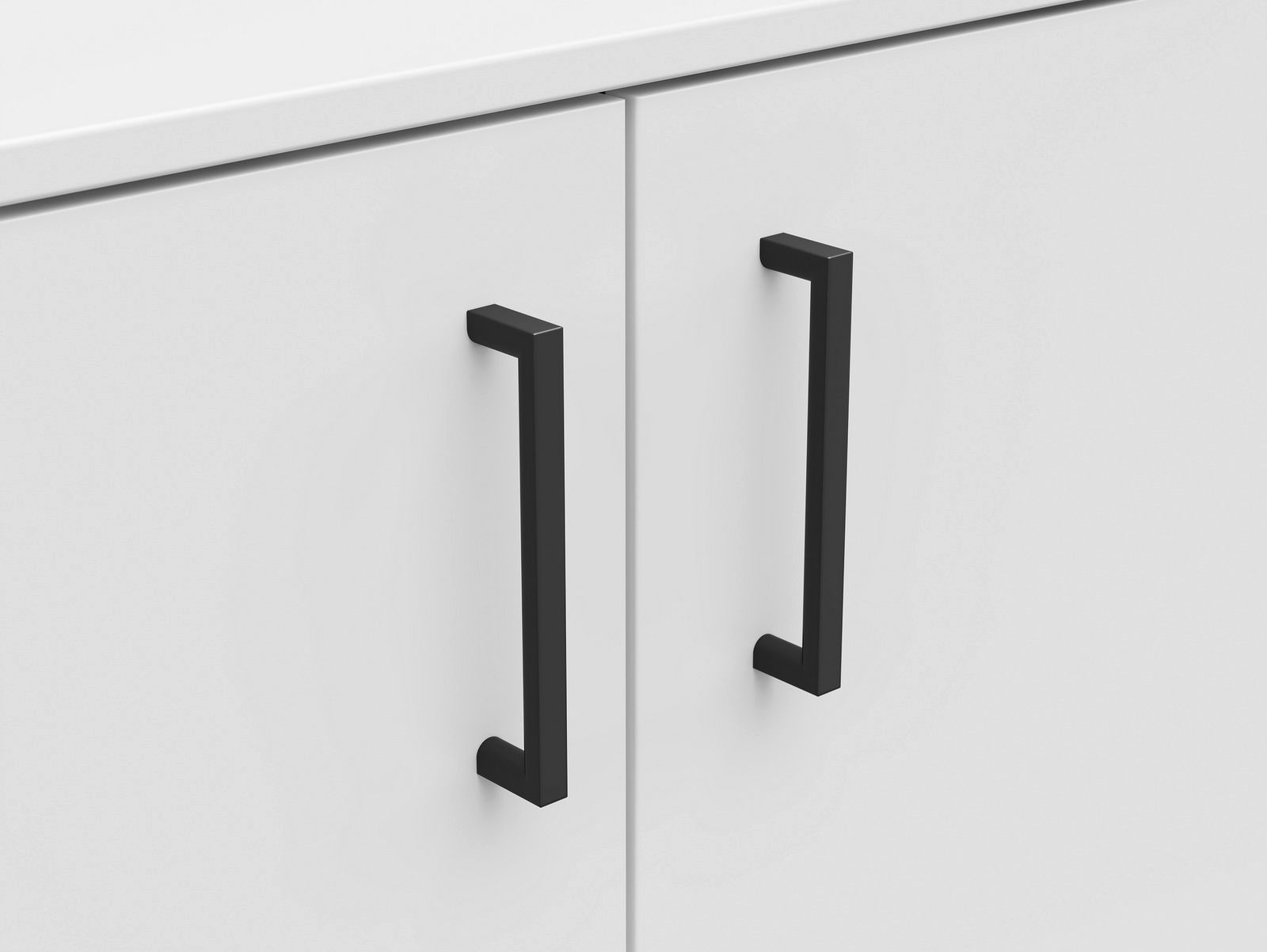 Nahaufnahme einer weißen Kommode mit zwei schwarzen Griffen, Frontalansicht