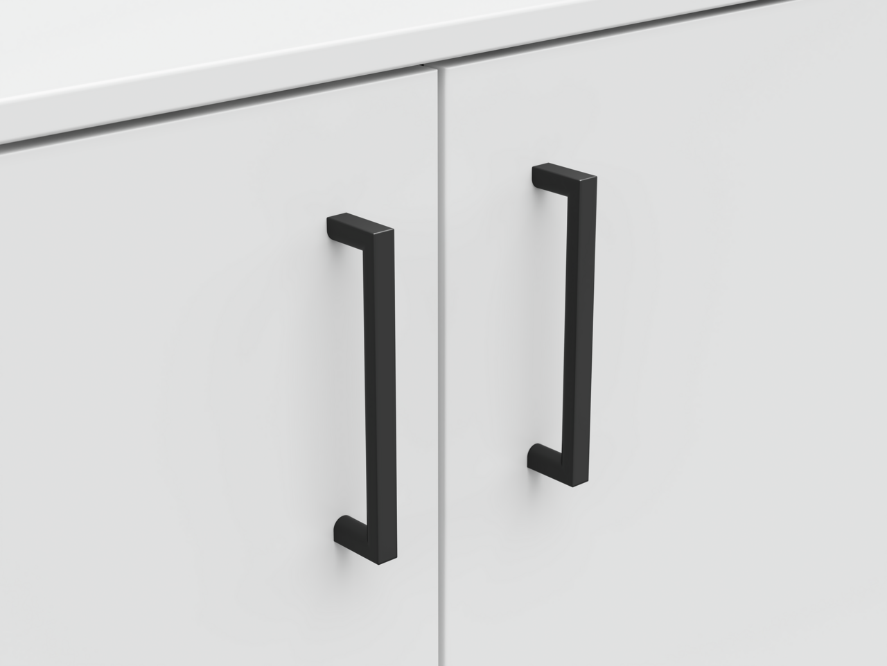 Nahaufnahme einer weißen Kommode mit zwei schwarzen Griffen, Frontalansicht