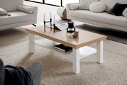 Moderner Couchtisch mit Holzplatte und weißen Beinen, seitliche Perspektive