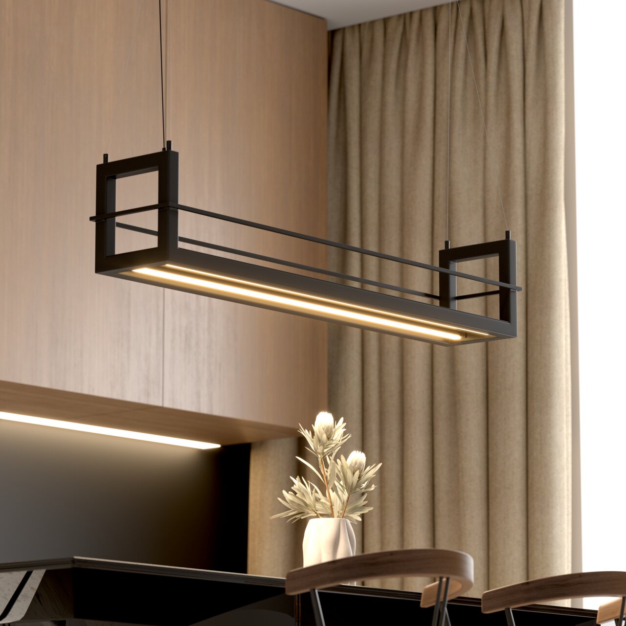 Moderne, rechthoekige led-hanglamp van matzwart metaal met warmwit licht boven een eettafel, schuin van onderaf gefotografeerd vanuit een zijdelingse hoek.