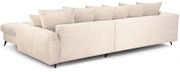 Beiges Cordsofa mit schwarzen Füßen und mehreren Rückenkissen, Ansicht von hinten links in leichter Perspektive