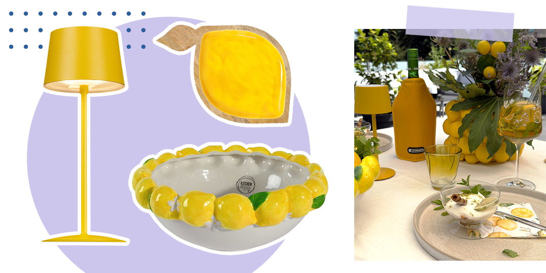 Gelbe Deko mit Zitronen: Tischlampe, Schale und Flaschenkühler auf sommerlich gedecktem Tisch.