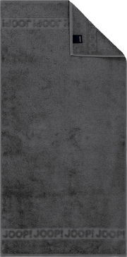 Dunkelgraues Joop! Handtuch aus Frottee mit eingewebter Logo-Bordüre, flach von oben in Frontansicht fotografiert, eine Ecke umgeschlagen und Etikett sichtbar