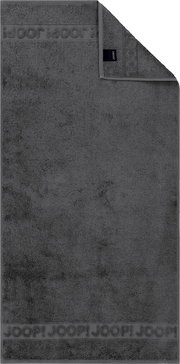 Dunkelgraues Joop! Handtuch aus Frottee mit eingewebter Logo-Bordüre, flach von oben in Frontansicht fotografiert, eine Ecke umgeschlagen und Etikett sichtbar