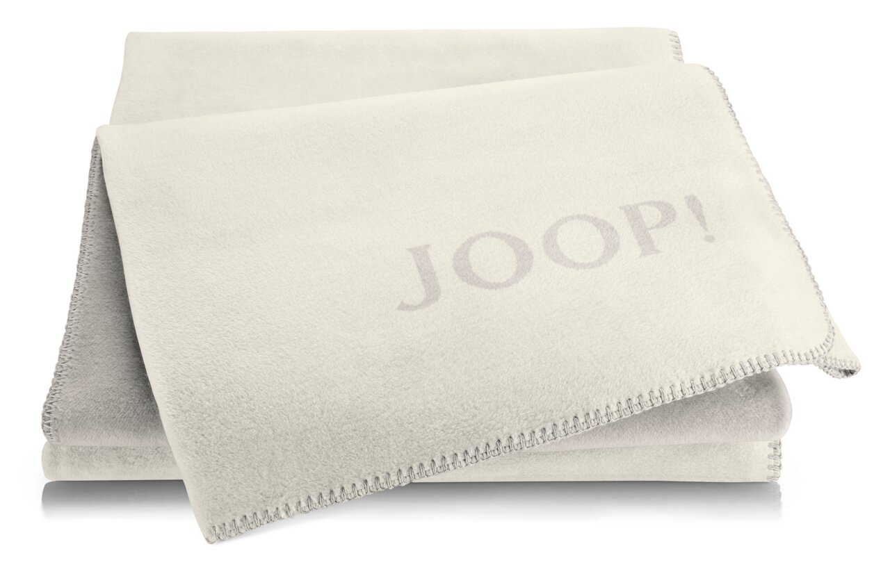 Beige Decke mit JOOP! Logo, gefaltet und von oben fotografiert