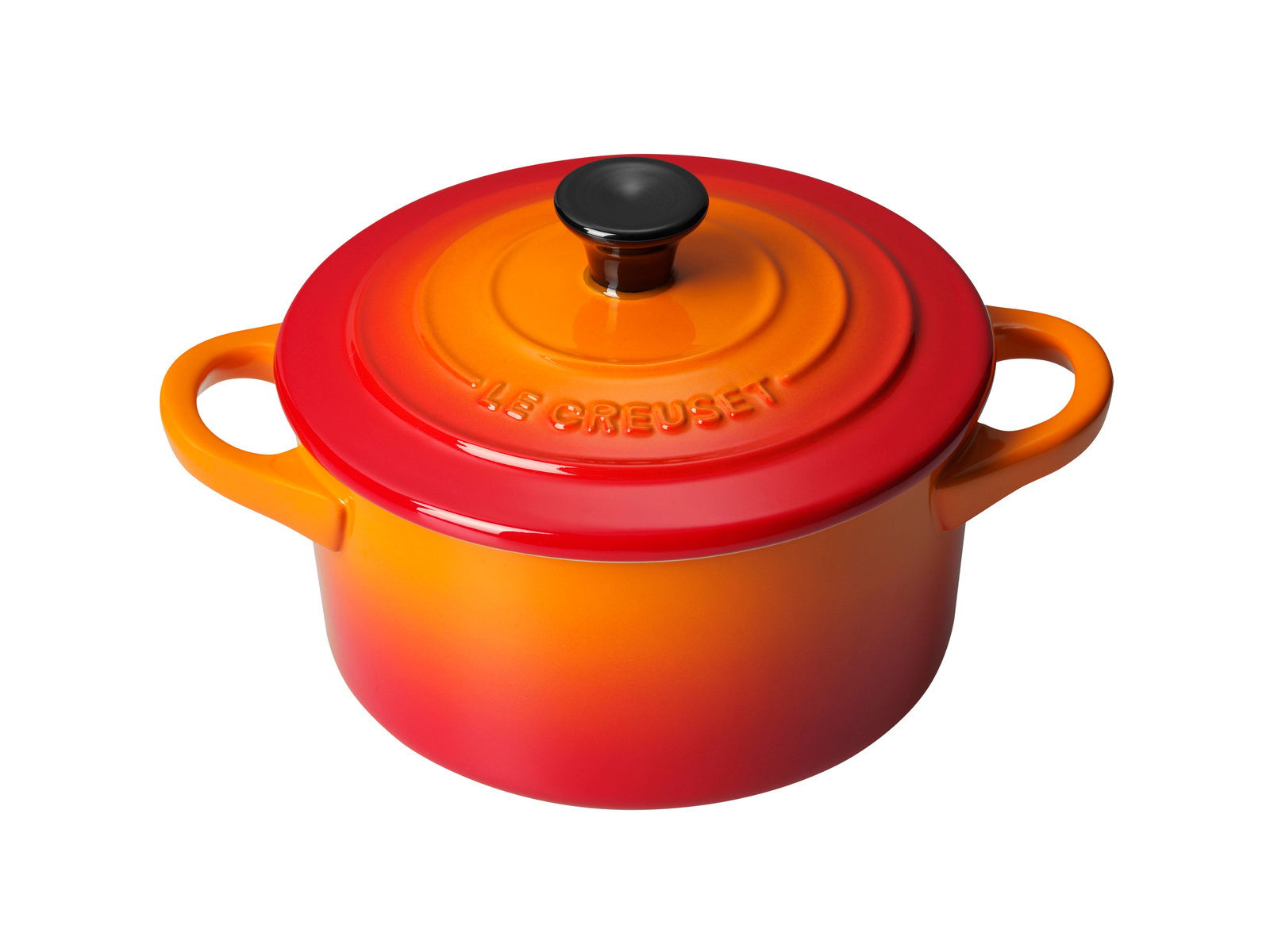 LE CREUSET Mini-cocotte 10 cm ovenrood Mini-Cocotte in Ofenrot, Draufsicht mit zwei Griffen und schwarzem Knauf auf dem Deckel.