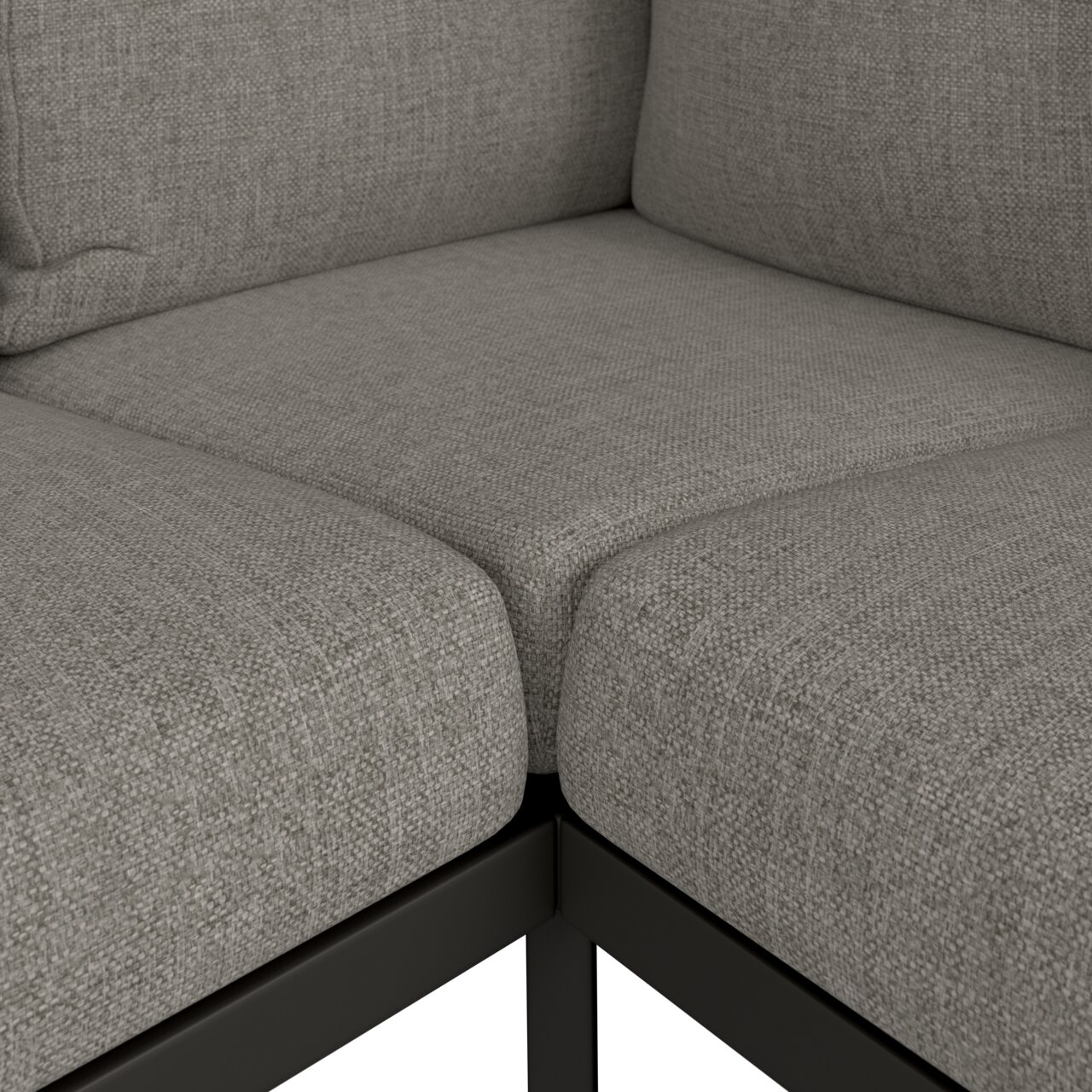 Nahaufnahme einer grauen Loungeecke mit Textilbezug und Metallrahmen, Perspektive von oben.