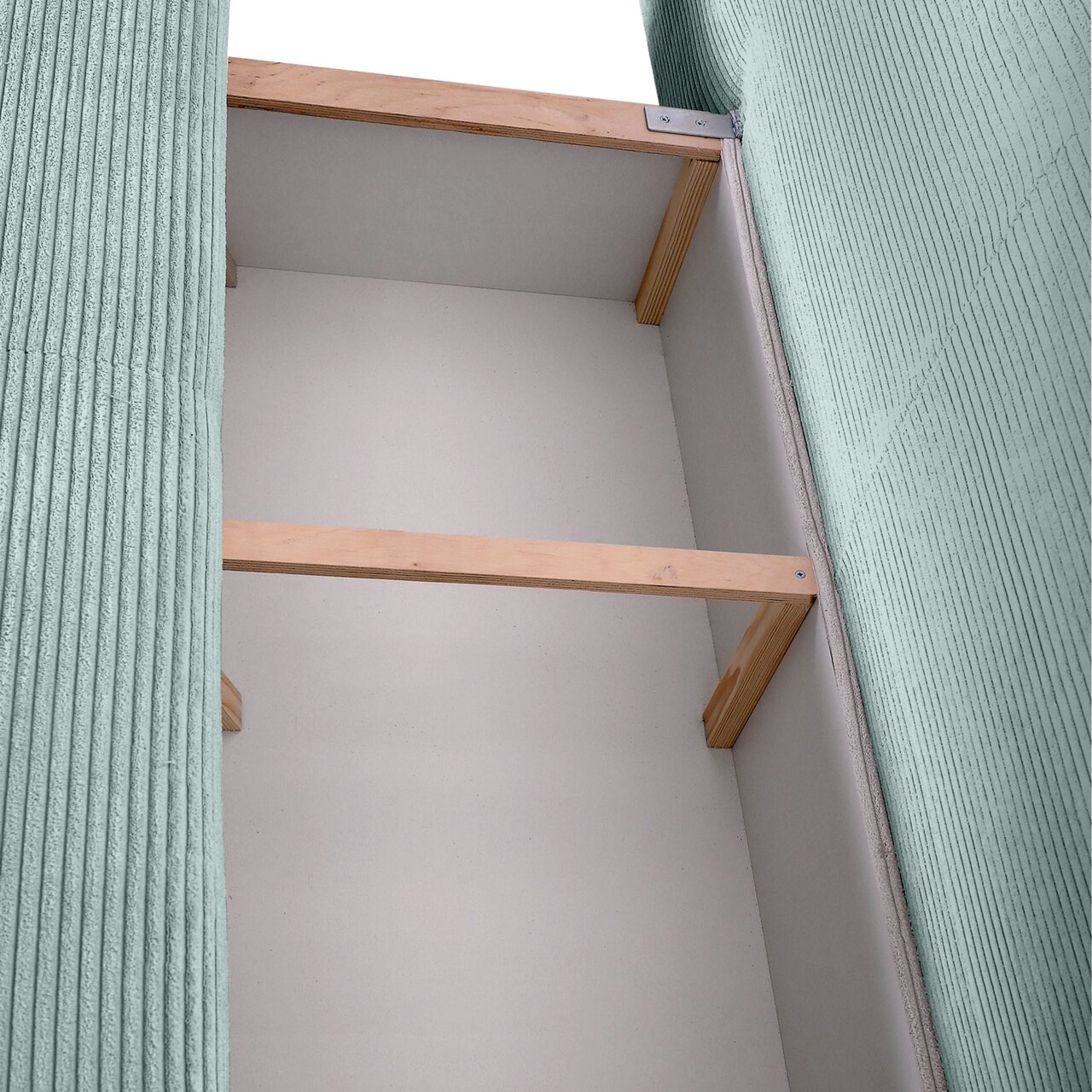 Innenansicht eines Funktionssofas mit Holzrahmen und grüner Polsterung, von oben betrachtet.