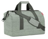 Grüne Reisetasche mit Tragegriff und Schultergurt, seitliche Perspektive