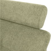 Nahaufnahme einer grünen, texturierten Sofaecke mit runder Rückenlehne, seitliche Perspektive