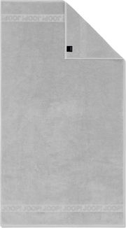 Hellgraues Joop! Handtuch mit eingewebter Logo-Bordüre und umgeschlagener Ecke, frontal von oben fotografiert.