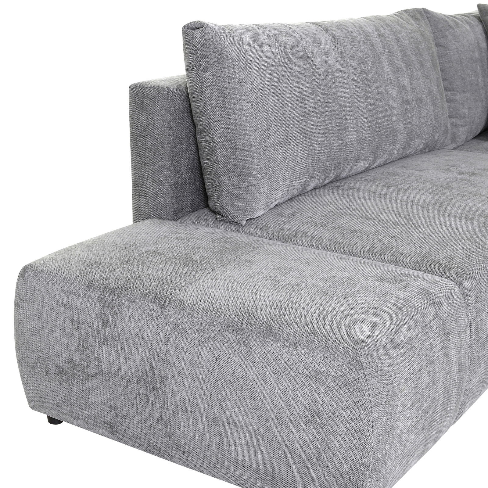 Graues Sofa mit abgerundeter Ecke, seitliche Perspektive