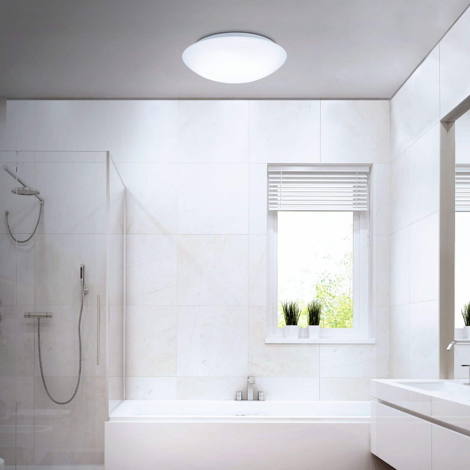 Briloner LED-plafondlamp ELIPSO Witte ronde plafondlamp in een moderne badkamer, gezien van onderen in een lichte ruimte met douche en raam.