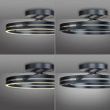 Moderne Deckenleuchte PURE Loop von Paul Neuhaus in schwarzem Metall mit zwei leuchtenden Ringen, seitliche Perspektive.