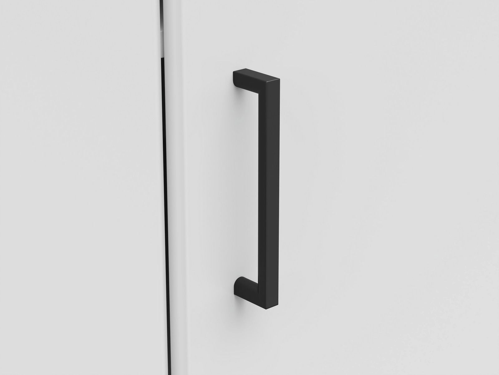 Carryhome Eckkommode MULTISTAURAUM Nahaufnahme eines schwarzen, modernen Griffs an einer weißen Eckkommode, seitliche Perspektive