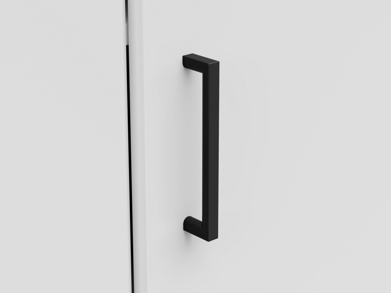 Carryhome Eckkommode MULTISTAURAUM Nahaufnahme eines schwarzen, modernen Griffs an einer weißen Eckkommode, seitliche Perspektive