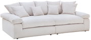 Großes, cremefarbenes Big-Sofa mit mehreren Kissen, Vorderansicht