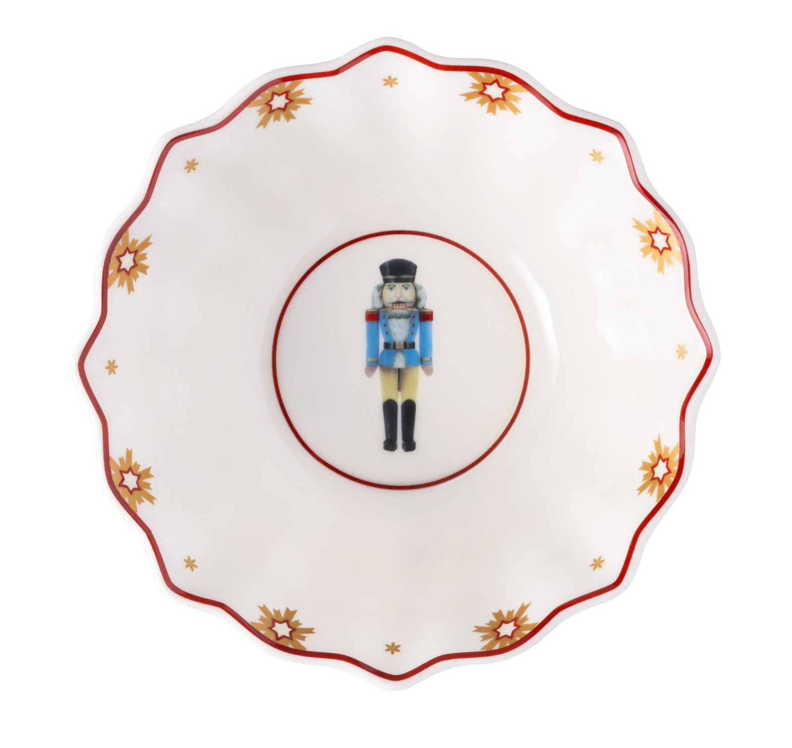 Porzellanschale mit Nussknacker-Motiv und goldenen Sternen, von oben betrachtet.