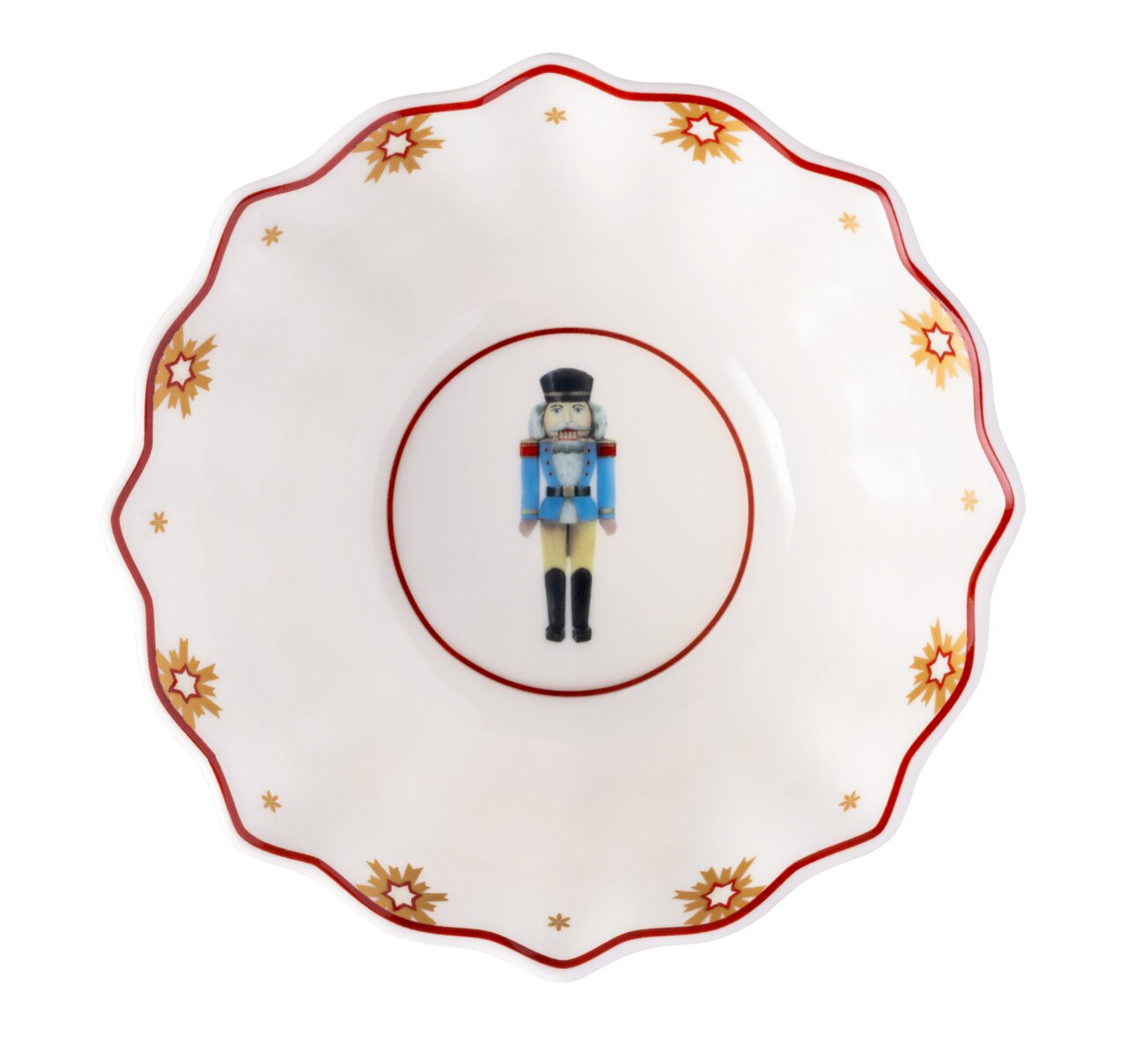 Porzellanschale mit Nussknacker-Motiv und goldenen Sternen, von oben betrachtet.
