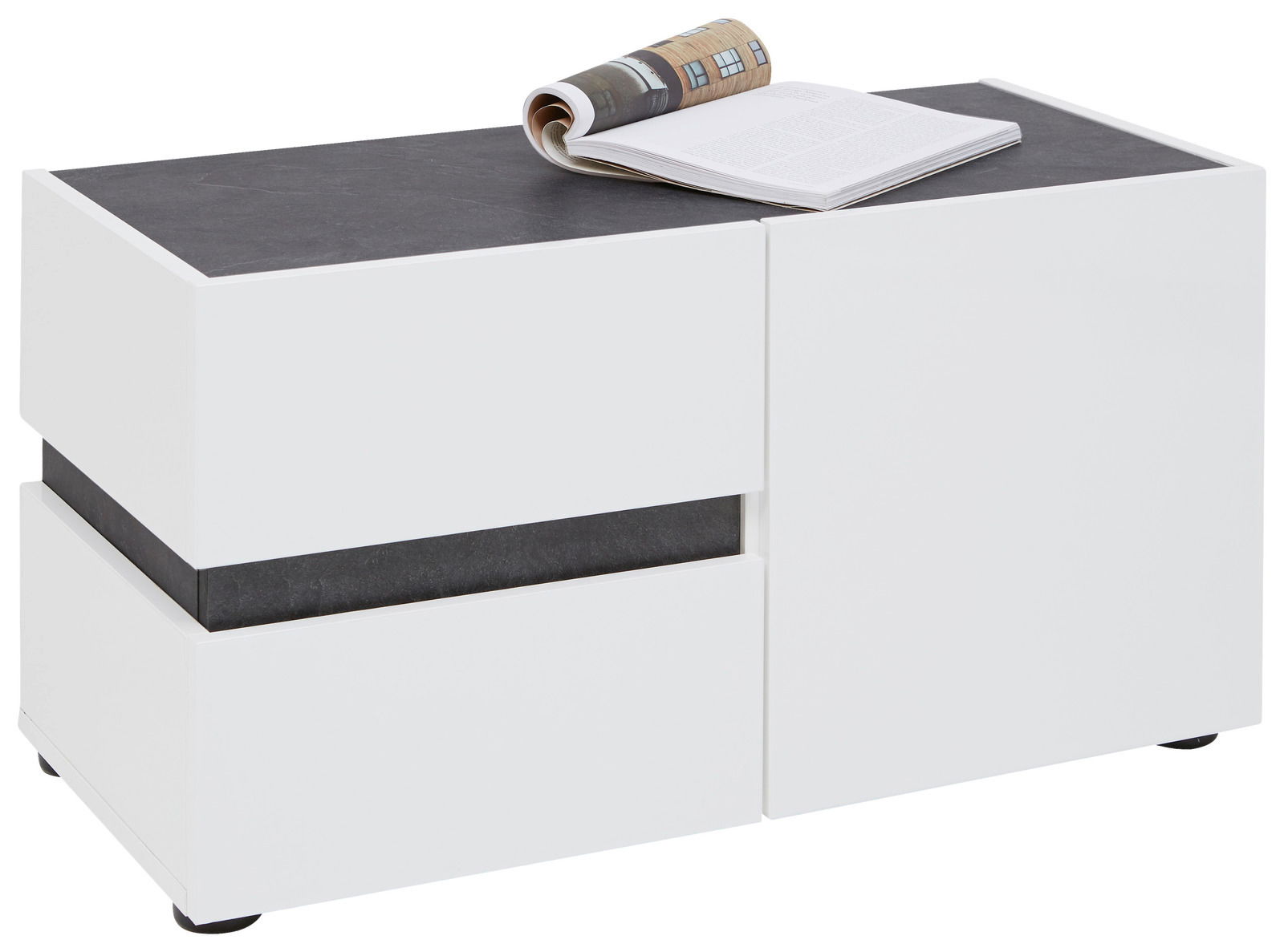 Voleo Bank YES Weiße Bank mit dunkler Oberfläche, darauf liegt ein aufgeschlagenes Buch, seitliche Perspektive