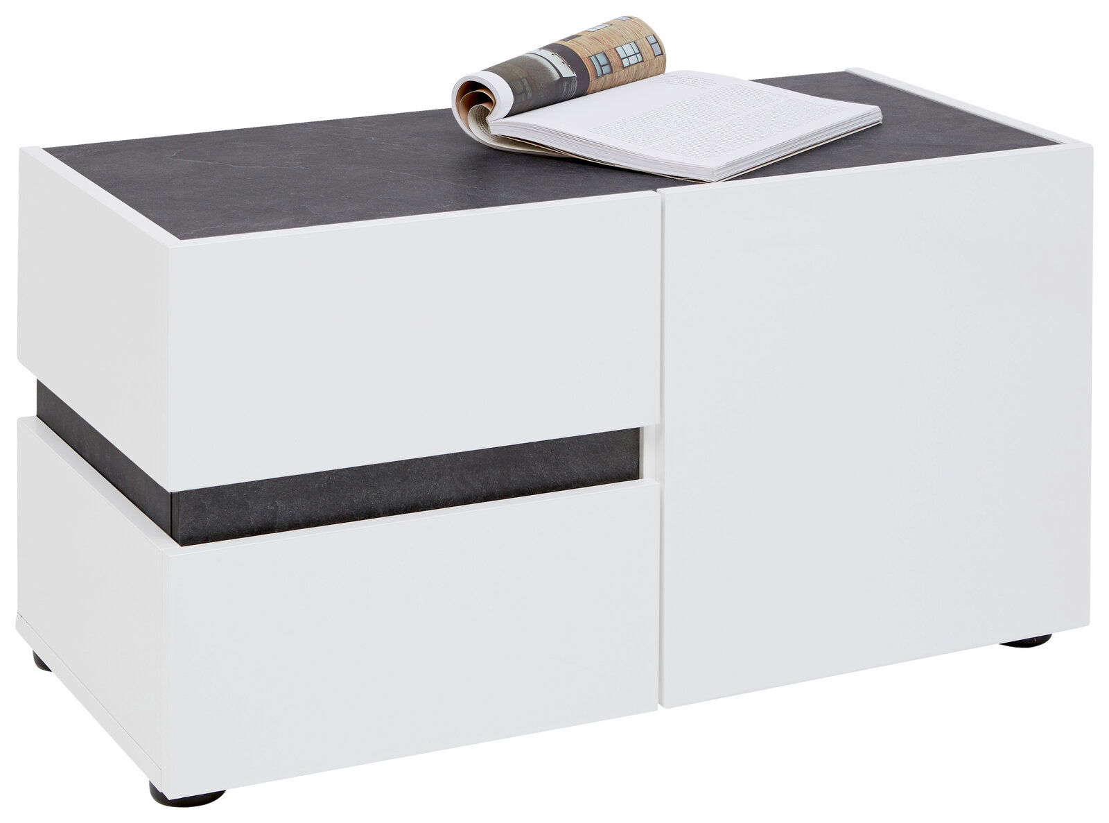 Weiße Bank mit dunkler Oberfläche, darauf liegt ein aufgeschlagenes Buch, seitliche Perspektive