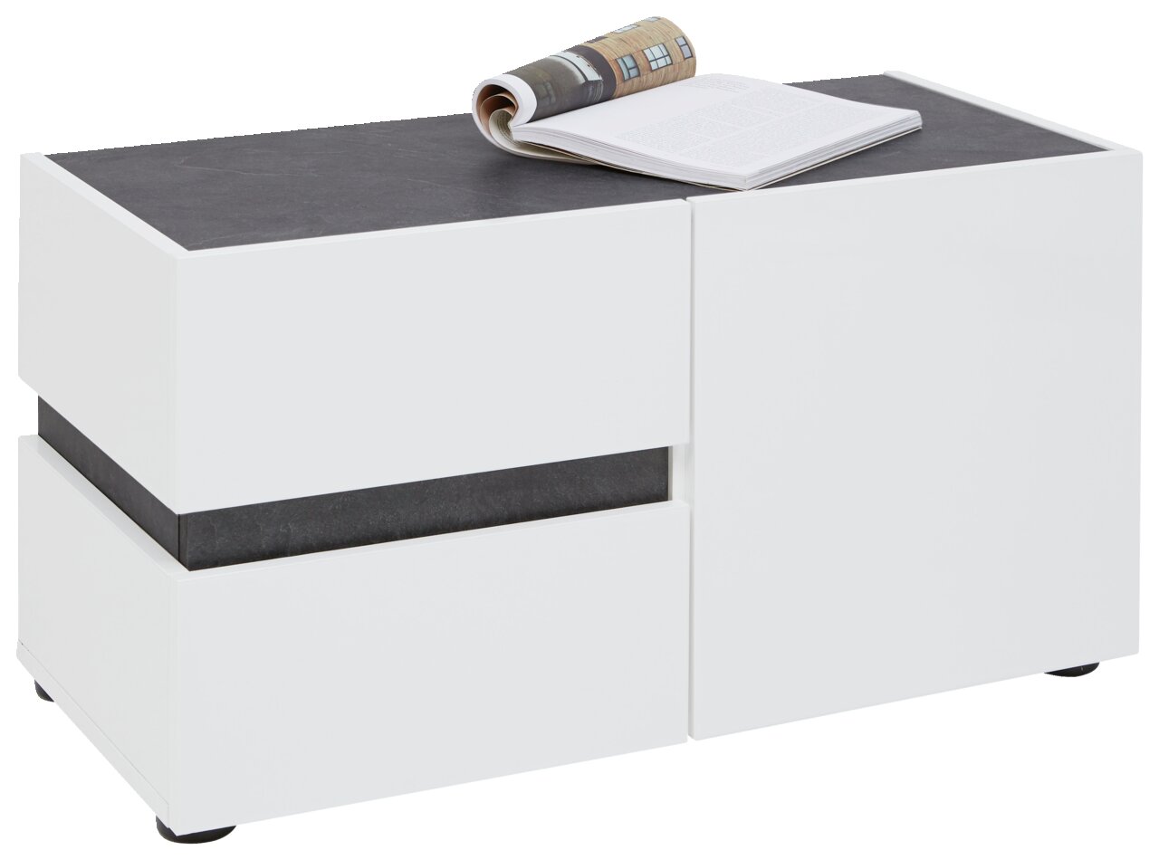 Voleo Bank YES Weiße Bank mit dunkler Oberfläche, darauf liegt ein aufgeschlagenes Buch, seitliche Perspektive