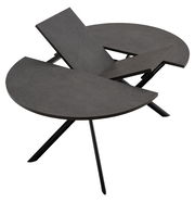 Moderner Esstisch mit runder, dunkler Tischplatte und ausziehbarer Funktion, seitliche Perspektive