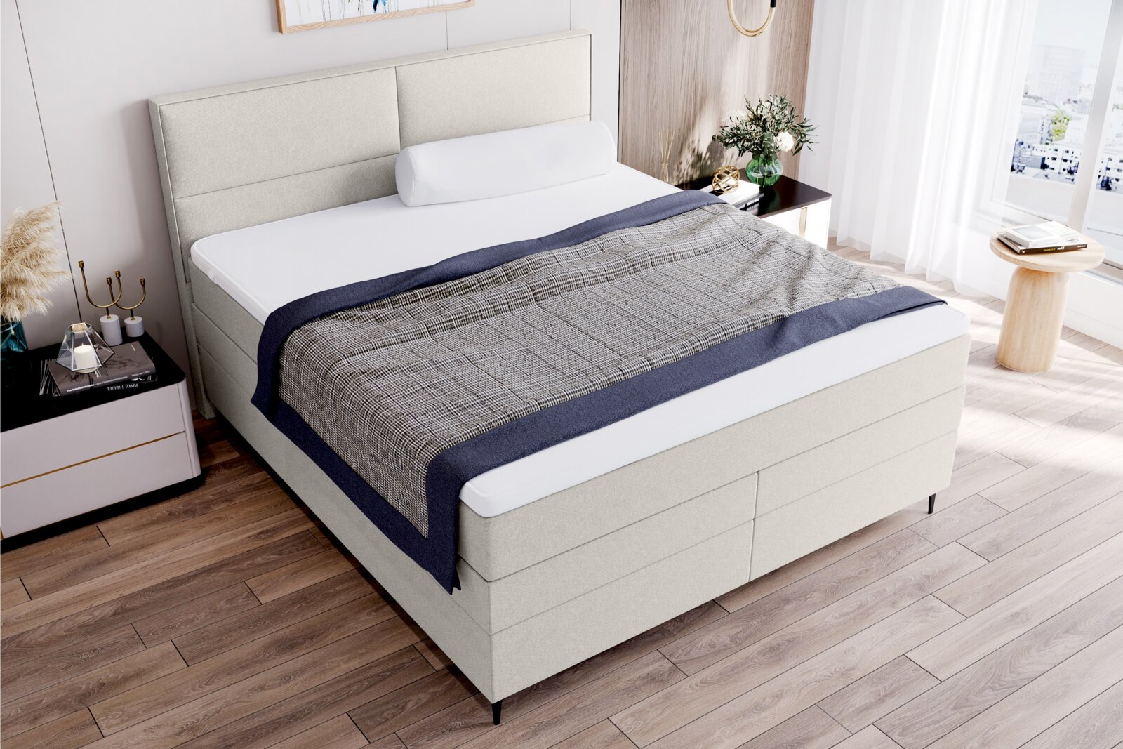 Boxspringbett in einem modernen Schlafzimmer, seitliche Perspektive, mit hellem Kopfteil und stilvoller Bettwäsche.