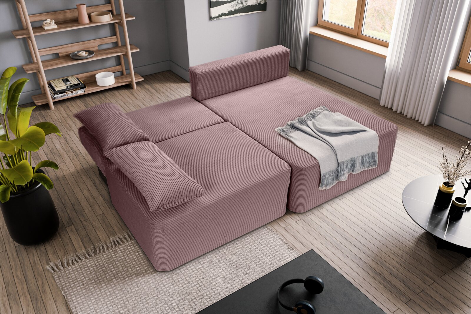 L-förmiges Schlafsofa in einem modernen Wohnzimmer, aus der Vogelperspektive betrachtet, mit einem weichen, rosa Stoffbezug und einer grauen Decke.