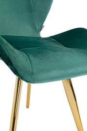 Grüner Stuhl mit goldenen Beinen, seitliche Perspektive
