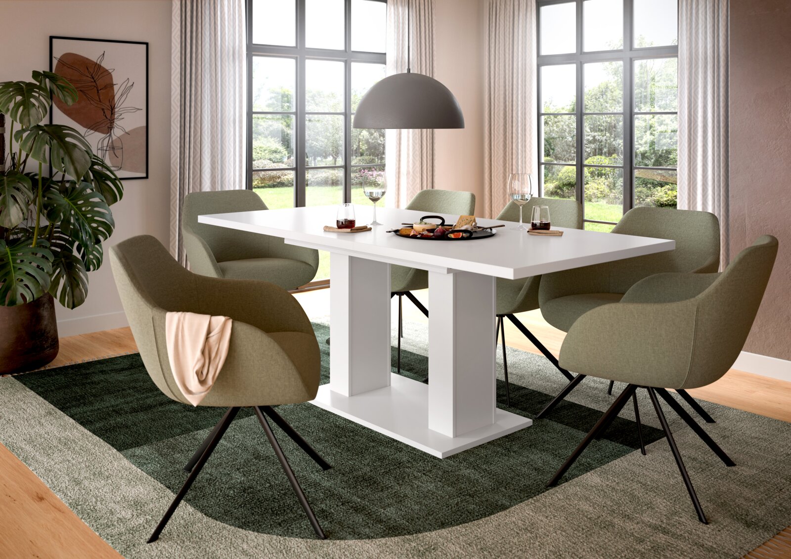 MID.YOU Esstisch MOTION Moderner weißer Esstisch mit sechs grünen Stühlen in einem hellen Esszimmer, seitliche Perspektive.