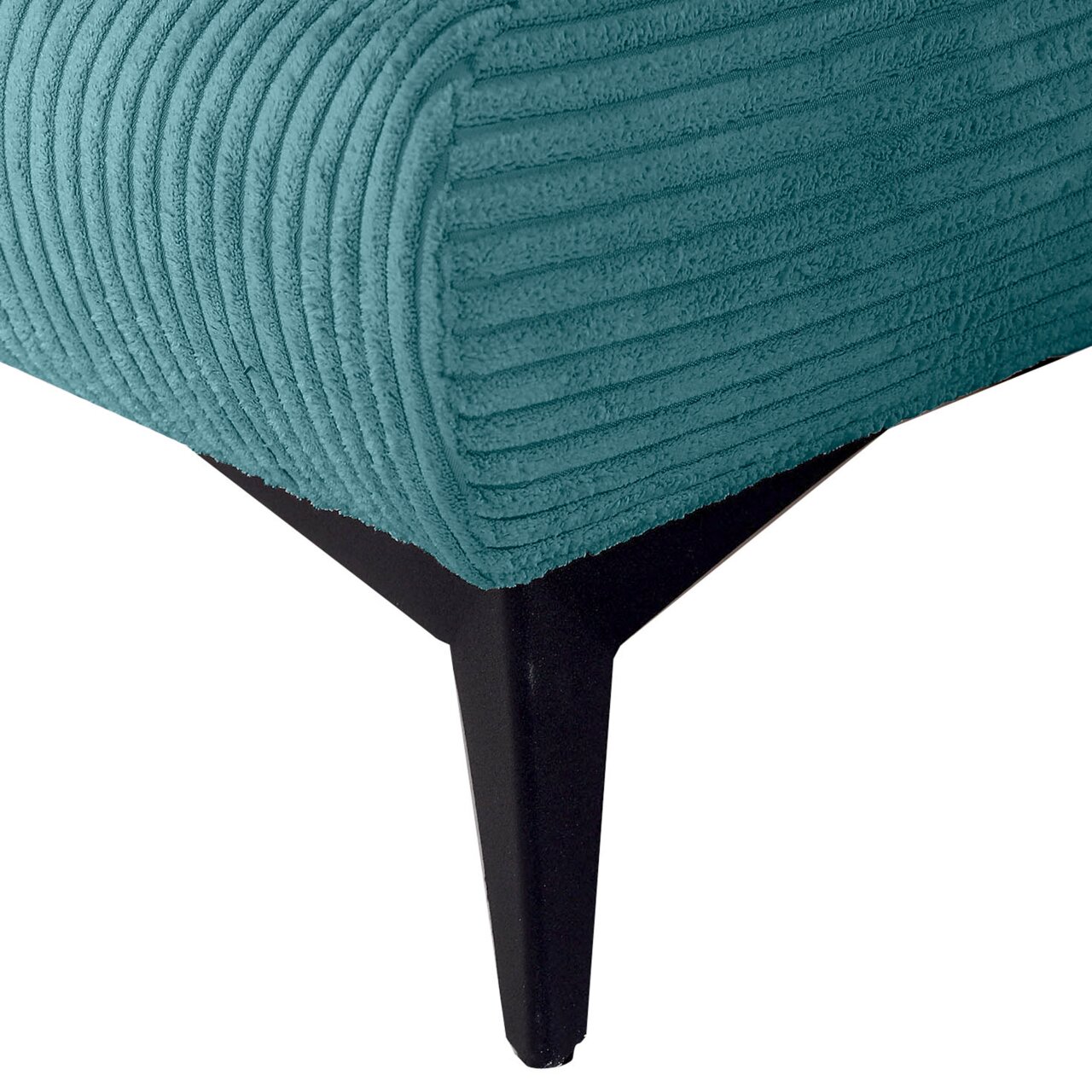 Nahaufnahme eines Funktionssofas mit türkisfarbenem, geripptem Stoffbezug und schwarzem Metallfuß.