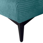 Nahaufnahme eines Funktionssofas mit türkisfarbenem, geripptem Stoffbezug und schwarzem Metallfuß.