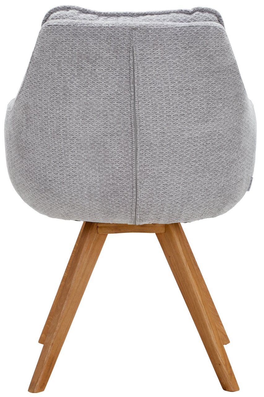 Rückansicht eines grauen Armlehnstuhls mit Holzbeinen