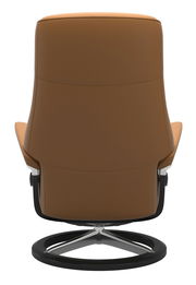 Rückansicht eines braunen Stressless Einzelsessels PHILIP mit modernem Design und schwarzem Drehfuß.