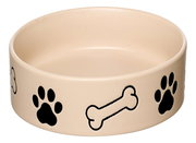 Beige Hundenapf mit schwarzen Pfotenabdrücken und Knochenmotiven, seitliche Perspektive