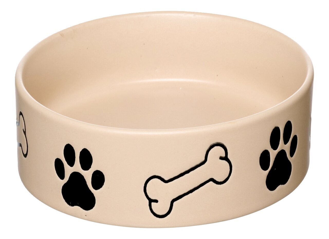 Beige Hundenapf mit schwarzen Pfotenabdrücken und Knochenmotiven, seitliche Perspektive