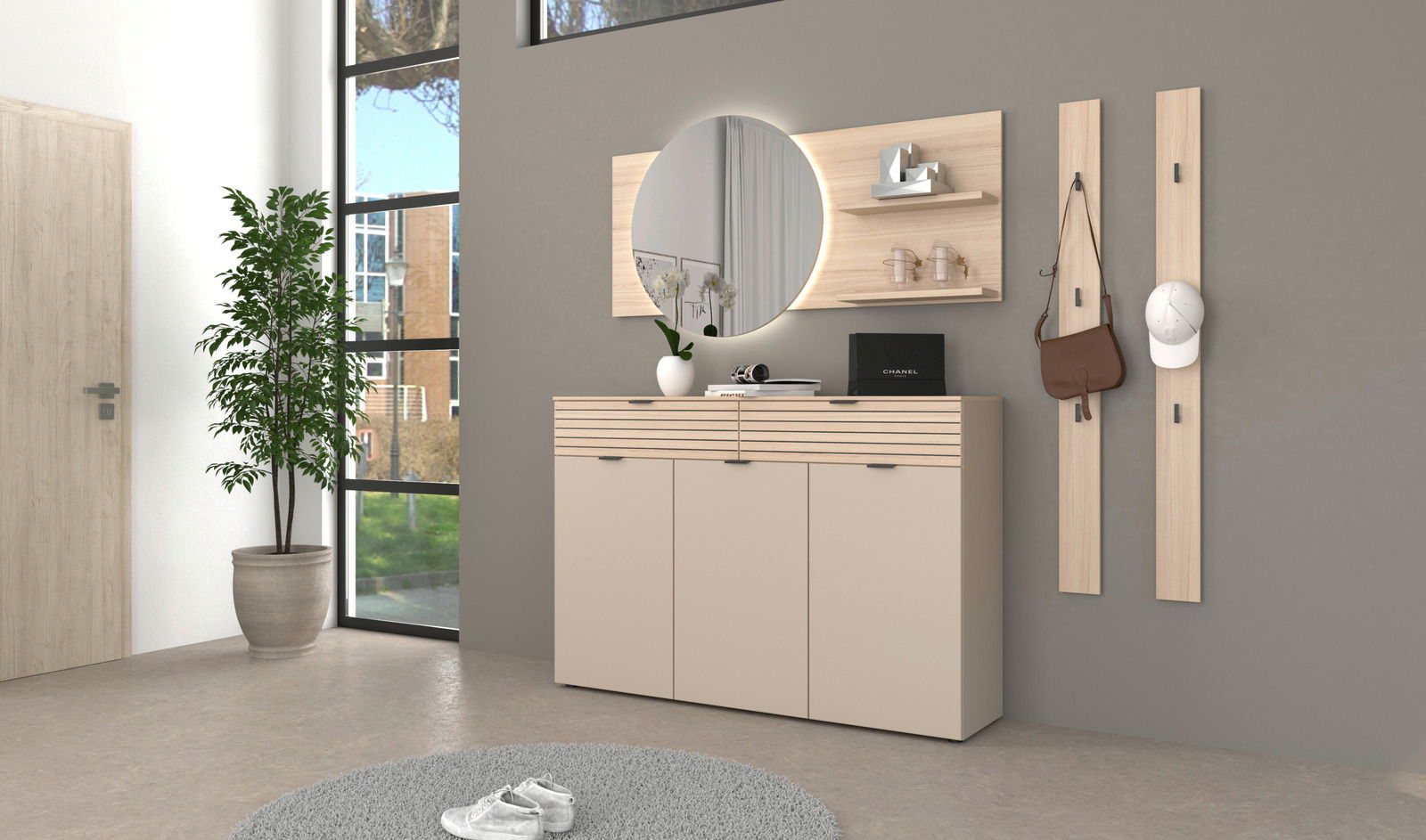 Moderne Garderobeneinrichtung mit Schuhschrank, rundem Spiegel und Garderobenpaneelen in einem hellen Raum, seitliche Perspektive.