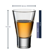 Ein transparenter Avernabecher Gilli aus Glas, frontal fotografiert, mit einer Höhe von 110 mm und einem Durchmesser von 68 mm, teilweise gefüllt mit einer bernsteinfarbenen Flüssigkeit.