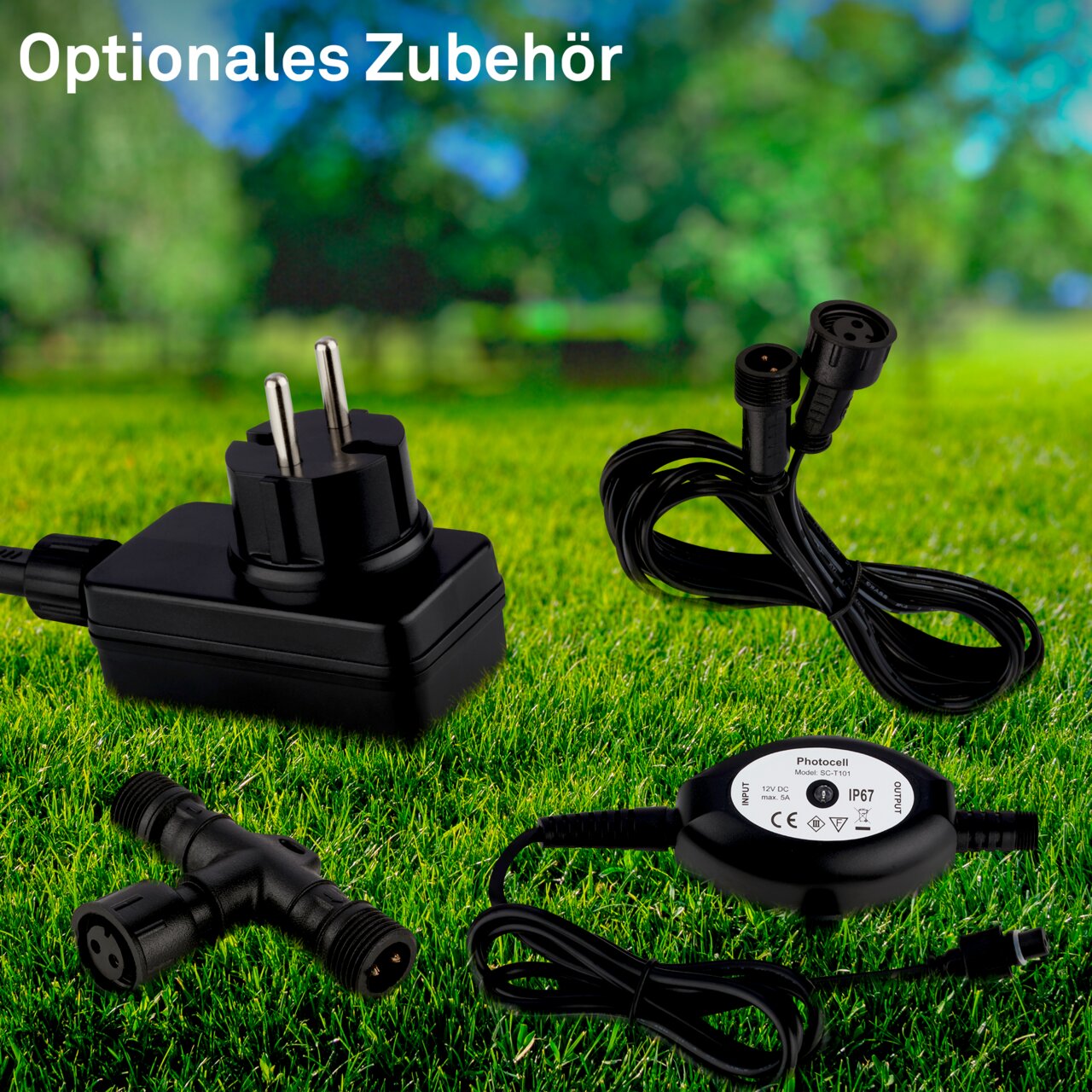 Erweiterungsset aus Edelstahl mit Netzteil, Kabel und Verbindungsstücken, auf einer Wiese präsentiert, Perspektive von oben.