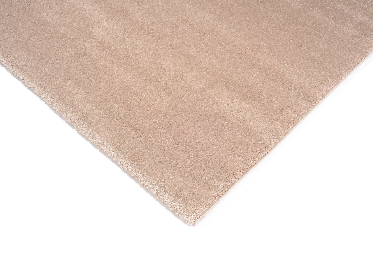 Beige Uni-Teppich in Nahaufnahme, perspektivisch von oben fotografiert