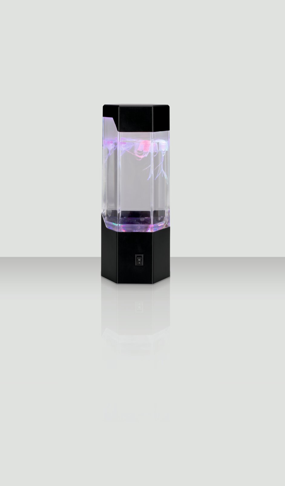 LED-Dekoleuchte mit schwarzem Sockel und transparentem Gehäuse, das von innen in verschiedenen Farben leuchtet. Frontalansicht.