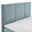 Boxspringbett mit hellblauem Kopfteil und weißer Matratze, seitliche Perspektive