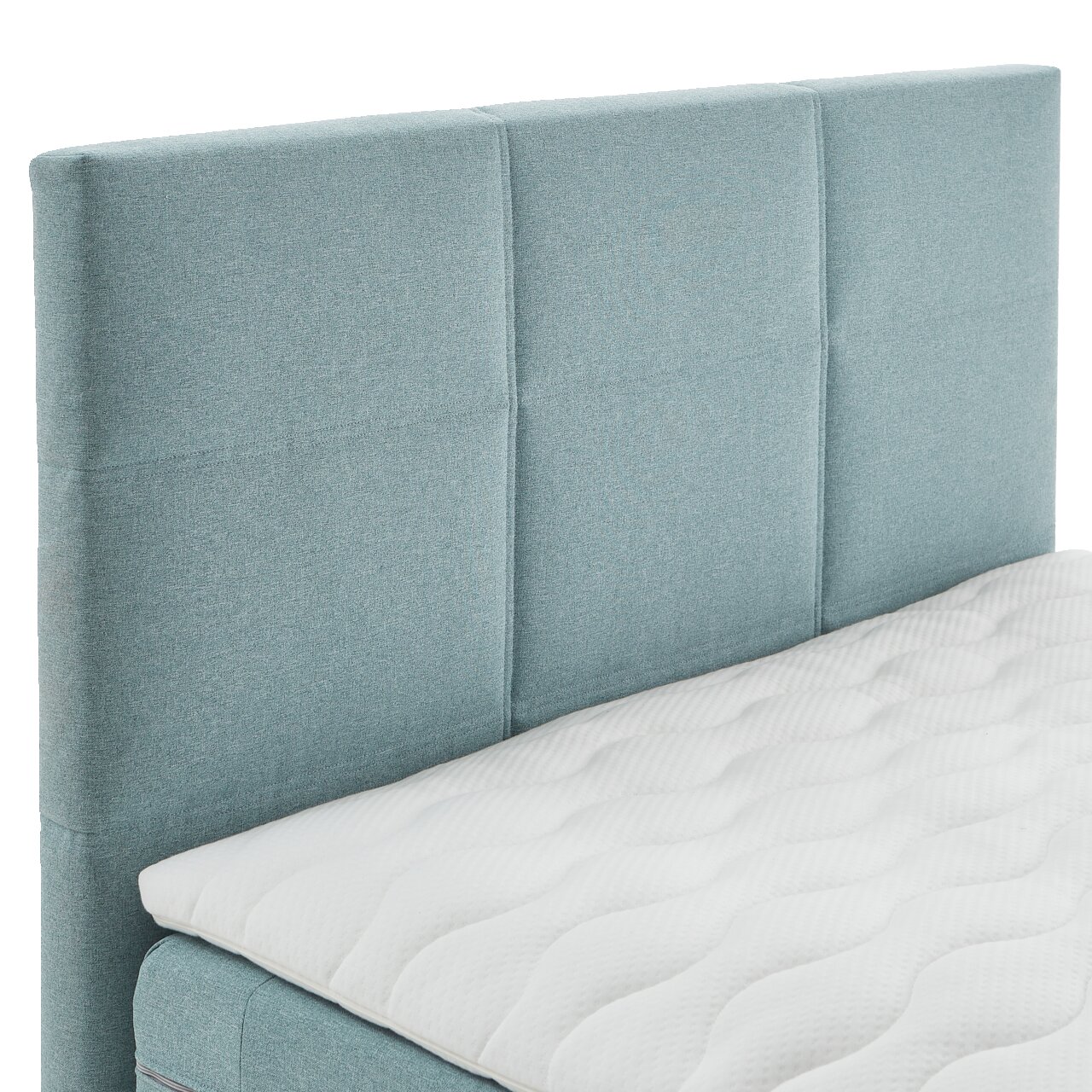 Boxspringbett mit hellblauem Kopfteil und weißer Matratze, seitliche Perspektive
