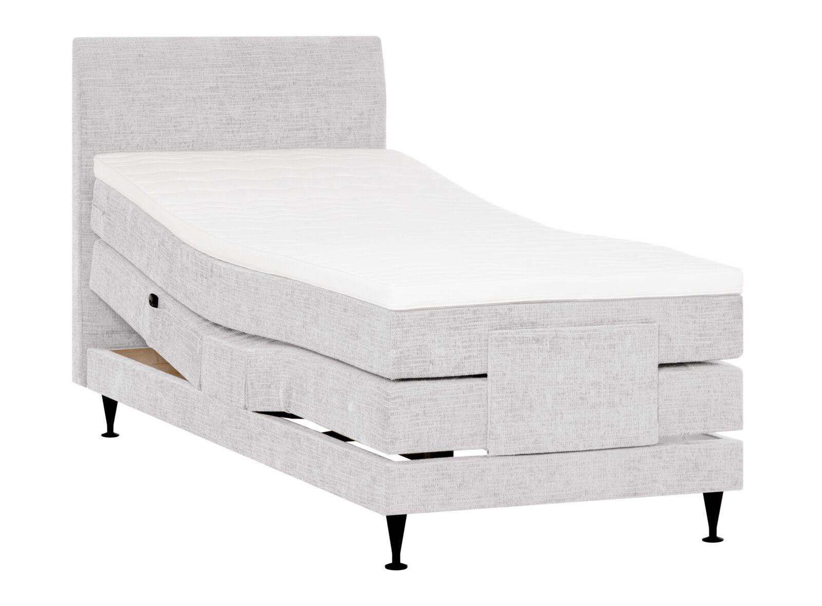 Lichtgrijs gestoffeerd elektrisch verstelbaar bed met hoog hoofdbord, wit matras, zwarte poten en open opberglade, schuin van voren weergegeven.