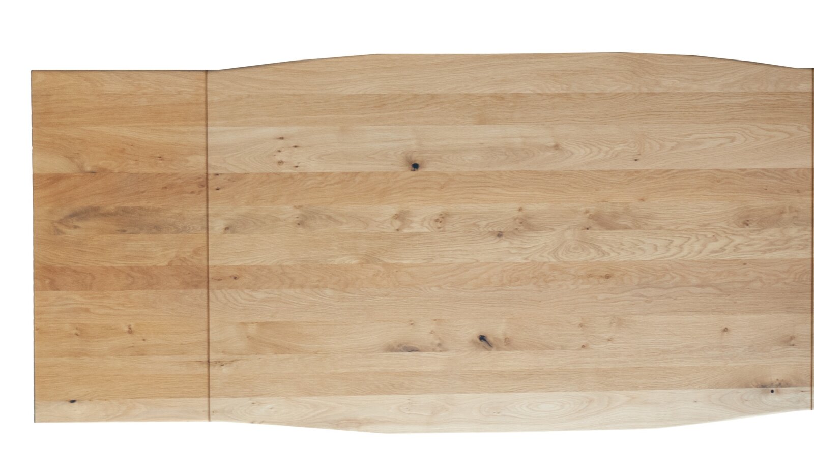 Vogelperspektive auf einen großen Esstisch aus hellem Holz mit natürlicher Maserung.