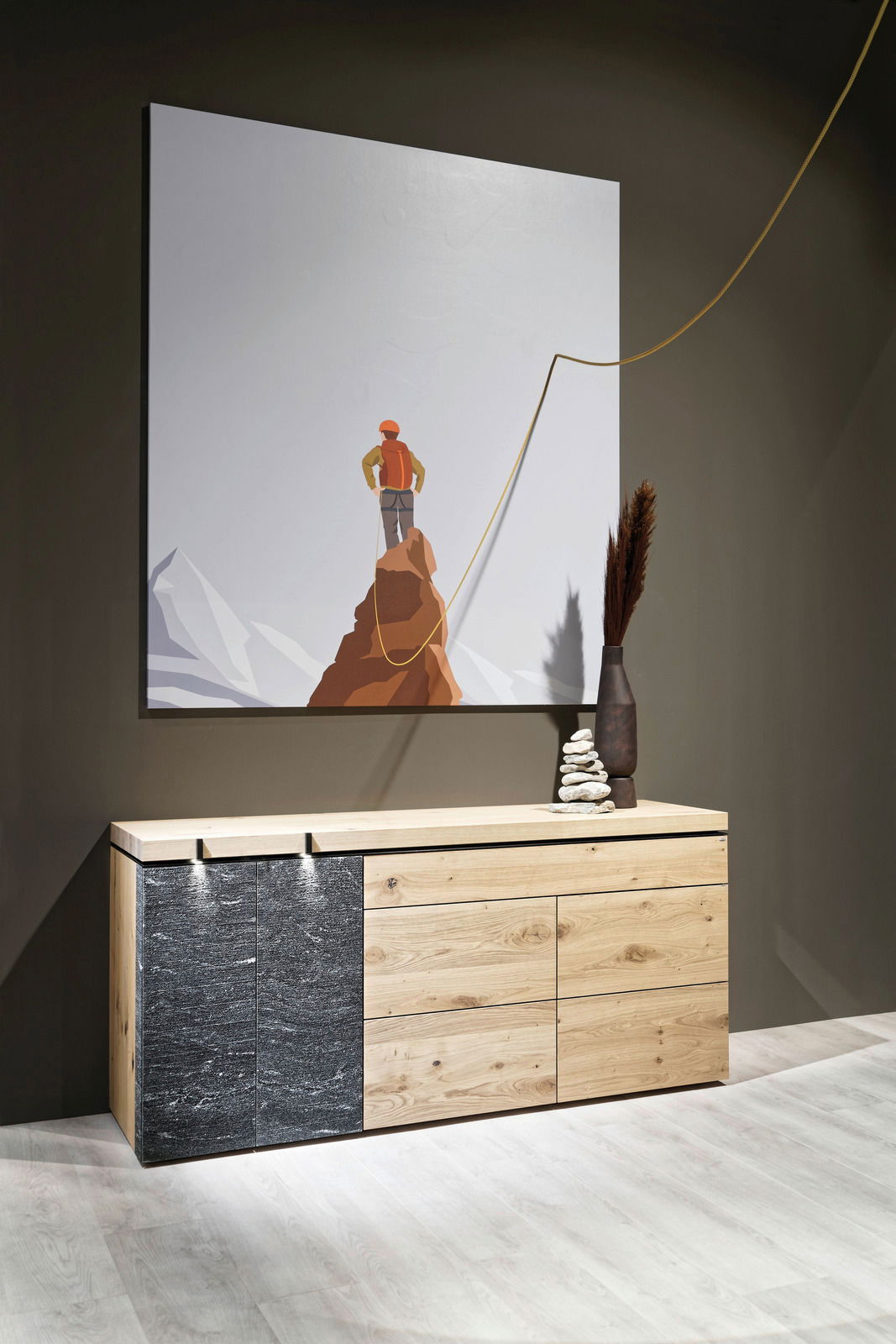 Voglauer Sideboard V-ROCK Modernes Sideboard aus Holz und Stein mit künstlerischem Bild im Hintergrund, seitliche Perspektive.