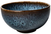 Seitliche Ansicht einer blauen Müslischale mit braunem Rand und einzigartigem Muster.